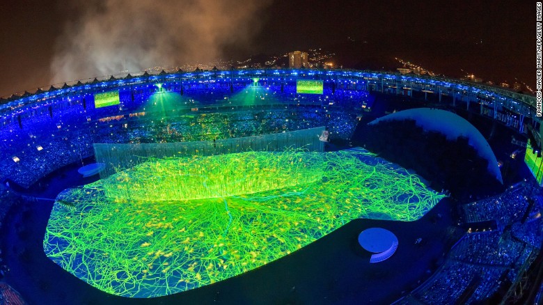 The colorful performances that opened the ceremony included lasers, 3-D projections and a cascade of water enveloping the stage.