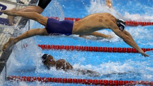 Michael Phelps back has cupping marks, as he competes in the Final of the Men&#39;s 4 x 100m Freestyle Relay.