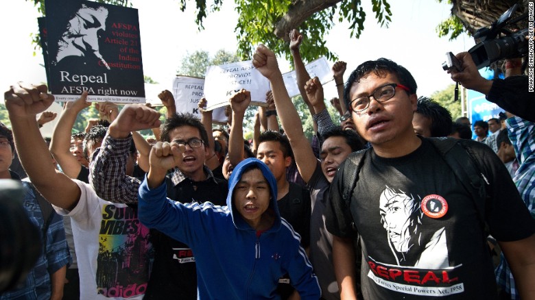 Supporters of Sharmila shout slogans outside the  New Delhi court where she made an appearance in March 2013. The activist rejected suicide charges put against her by the Delhi government.