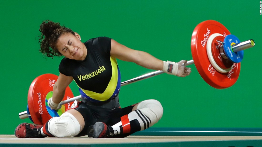 Venezuelan weightlifter Yusleidy Figueroa falls as she competes in the 58-kilogram weight class.