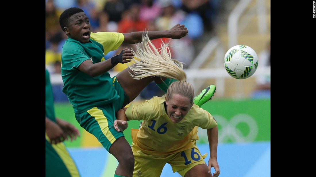 South Africa's Nothando Vilakazi, left, competes with Sweden's Elin Rubensson during the opening soccer match on Wednesday, August 3. Sweden won 1-0.