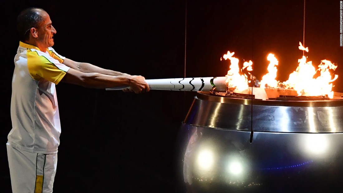 Vanderlei Cordeiro de Lima, a former Brazilian long-distance runner, lights the Olympic cauldron during <a href=