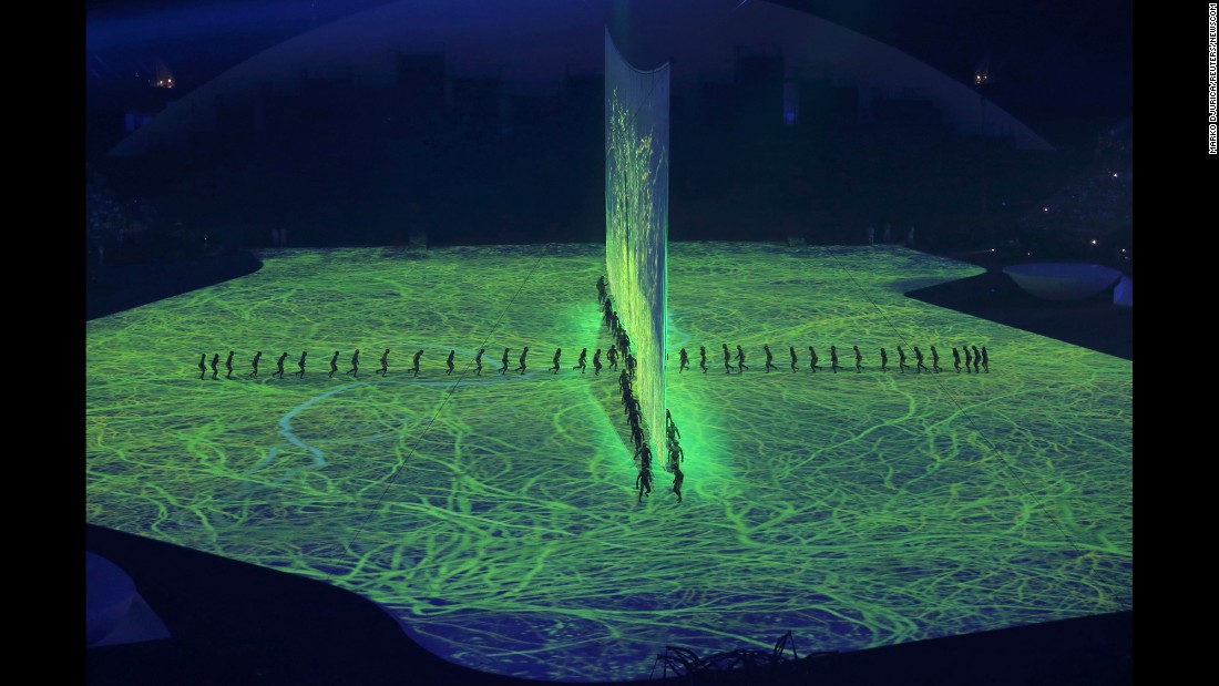 The opening ceremony included lasers, 3-D projections and a cascade of water enveloping the stage on Friday, August 5.