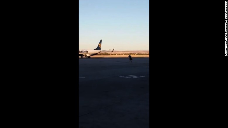 The passenger sprinted across tarmac to try and catch his plane.