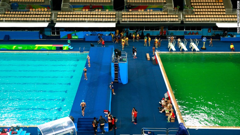 Olympic divers splash into green pool