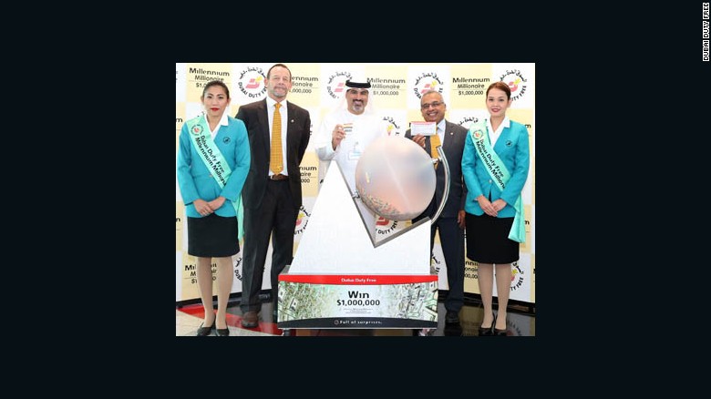 Khadar, second from right, accepts his prize