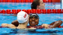 Simone Manuel and Penny Oleksiak of Canada embraced after their dead heat.
