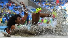 Brazil's Nubia Soares lands in the women's triple jump qualifying round.
