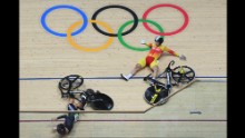 New Zealand's Olivia Podmore, left, and Spain's Tania Calvo Barbero fall during the women's Keirin first round track cycling event at the Velodrome on Saturday, August 13.