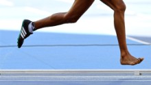Etenesh Diro of Ethiopia loses her shoe during the women's 3,000m steeplechase heats.
