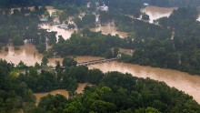 The Tangipahoa River overflows near the towns of Amite, Independence, Tickfaw and Robert on August 13.