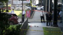 Sandals remain on a New York sidewalk following shooting.