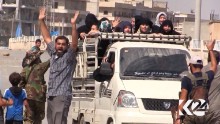 Civilians celebrate the liberation of Manbij