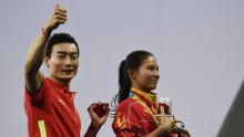 Qin gives the thumbs up to the crowd after the proposal.