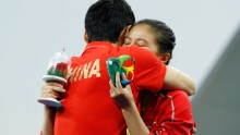 The couple embraced by the poolside.