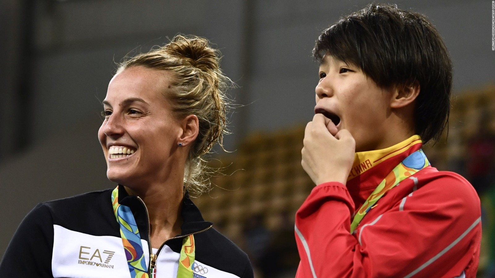 China's gold medalist Shi Tingmao (R) reacts with third-placed Tania Cagnotto of Italy.