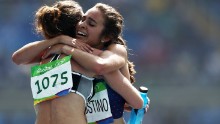 D'Agostino and Hamblin hug after their 5,000m race.