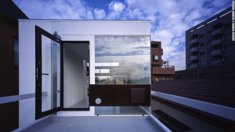 An industrial-style home designed by Atelier Tekuto, Wafers makes use of reinforced concrete, steel and highly reflective windows.