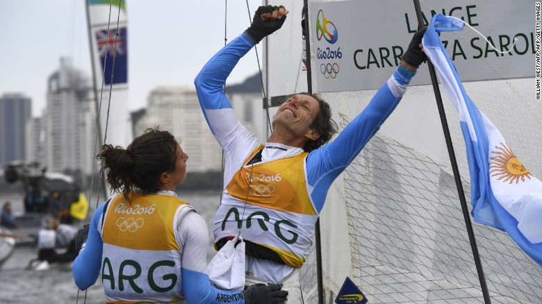 Argentina&#39;s Santiago Lange (right) and Cecilia Carranza Saroli celebrate winning sailing gold.