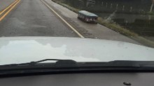 A casket sits on a road in Baton Rouge after getting washed out in flooding.