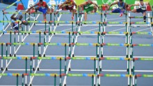 Ouch! Haiti's Jeffrey Julmis, crashes into the first hurdle in the men's 110m hurdles semifinal.