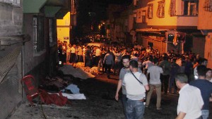 People gather after an explosion in Gaziantep, southeastern Turkey, early Sunday, Aug. 21, 2016. Gaziantep Province Gov. Ali Yerlikaya said the deadly blast, during a wedding near the border with Syria, was a terror attack. (Eyyup Burun/DHA via AP)e