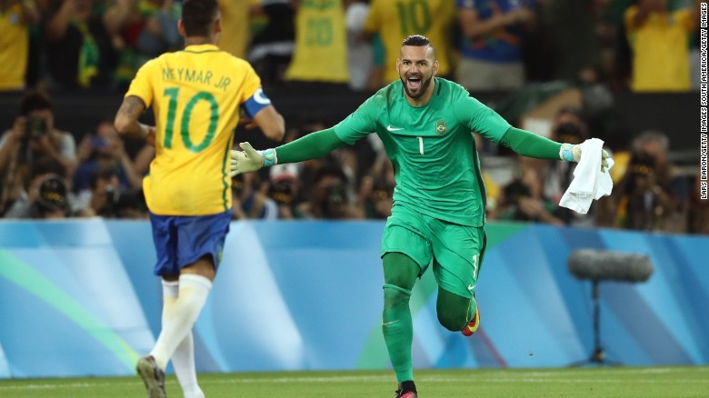 Brazil goalkeeper Weverton celebrates with Neymar at the Maracana Stadium.