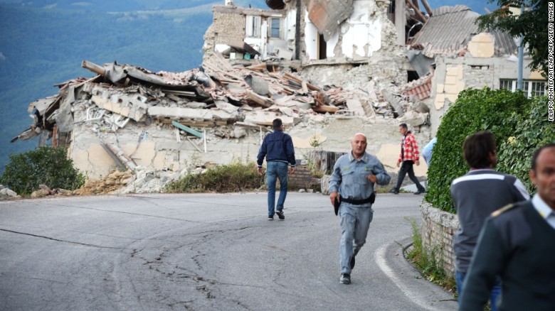 Victims and rescuers walk among the rubble of houses after a strong heartquake hit Amatrice on August 24, 2016.

Central Italy was struck by a powerful, 6.2-magnitude earthquake in the early hours, which has killed at least three people and devastated dozens of mountain villages. Numerous buildings had collapsed in communities close to the epicenter of the quake near the town of Norcia in the region of Umbria, witnesses told Italian media, with an increase in the death toll highly likely. / AFP PHOTO / FILIPPO MONTEFORTEFILIPPO MONTEFORTE/AFP/Getty Images