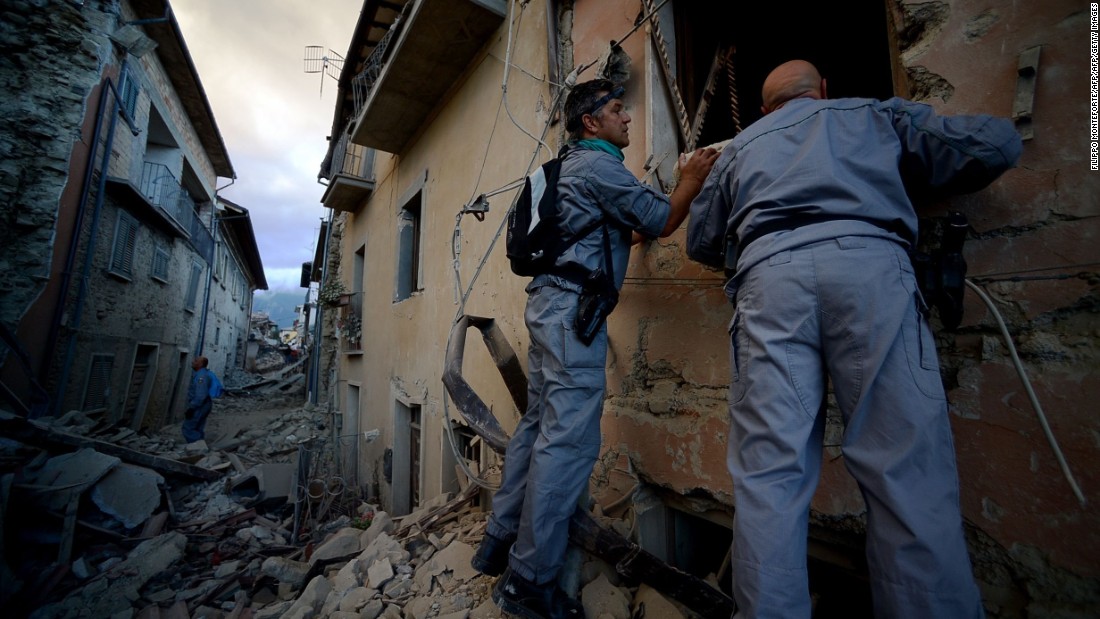 Rescuers search for victims in Amatrice on August 24.
