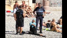 Burkini ban: Police in Nice force woman to remove part of clothing
