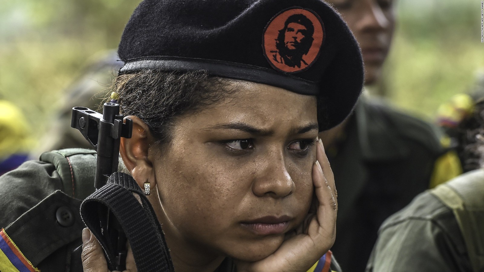 A FARC guerrilla listens during a class on the peace process and how life will be in the future.