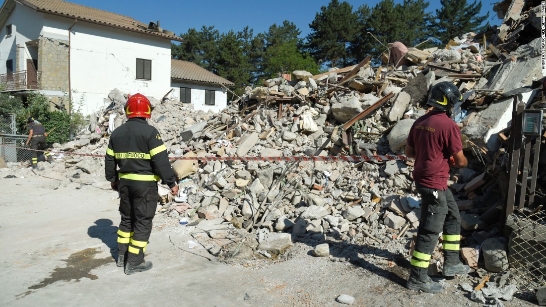 Firefighters cordon off an area around the rubble from a destroyed building Friday, August 26, in Amatrice, the hardest-hit town in the 6.2-magnitude earthquake that struck central Italy. Hundreds of people have been killed, and the death toll is expected to rise as rescue teams reach remote areas.