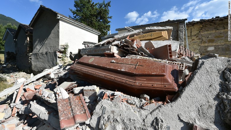 Damaged coffins and rubble are seen at the cemetery of Sant&#39;Angelo, Italy, on August 27. 