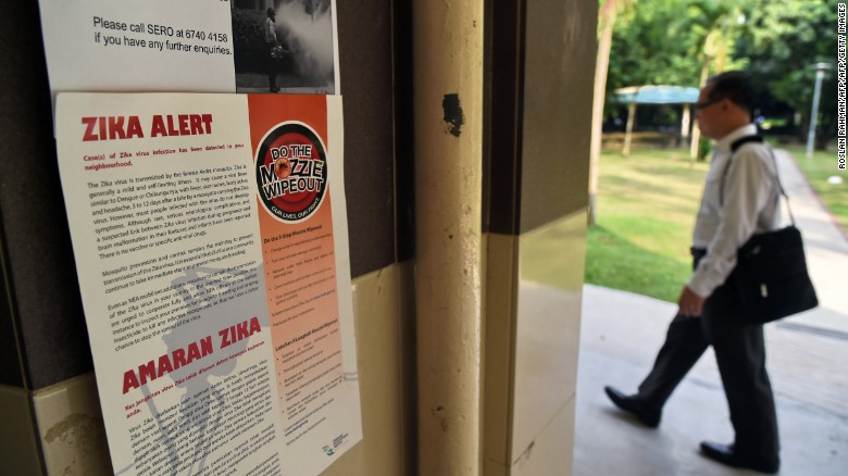 A Zika alert notice is seen posted at the lift landing area of a residential block in the Aljunied Crescent neighbourhood in Singapore on August 29, 2016.   