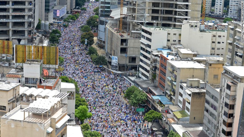 Opposition activists march in Caracas, on September 1, 2016.