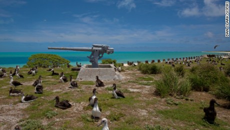 Obama highlights climate agenda on tiny Midway island