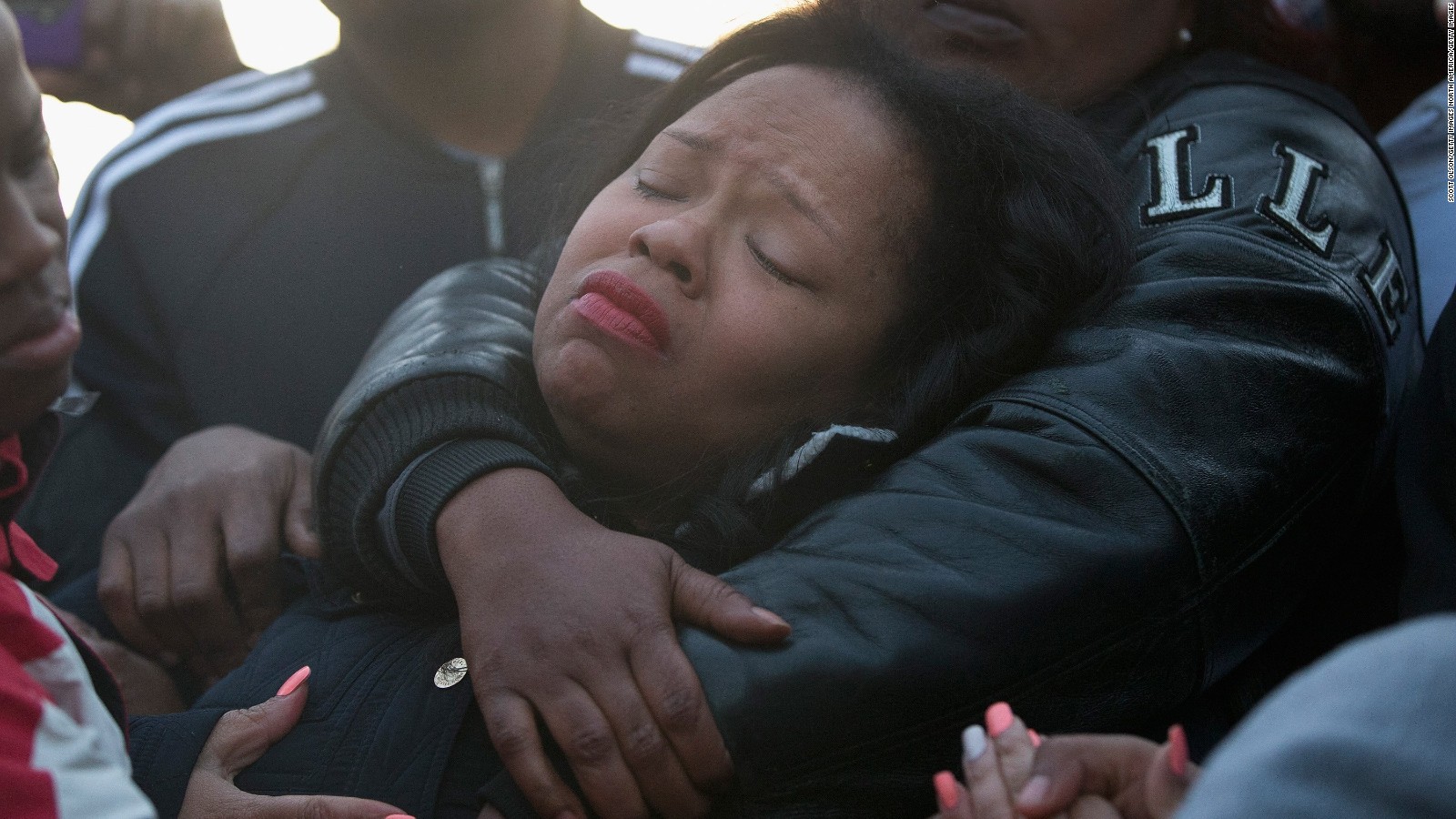 Tambrasha Hudson is comforted as she joins demonstrators protesting the shooting death of her son 16-year-old Pierre Loury on April 12, 2016 in Chicago.