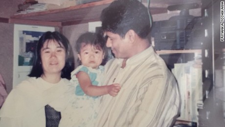 Priyanka Yoshikawa with her parents as a toddler.