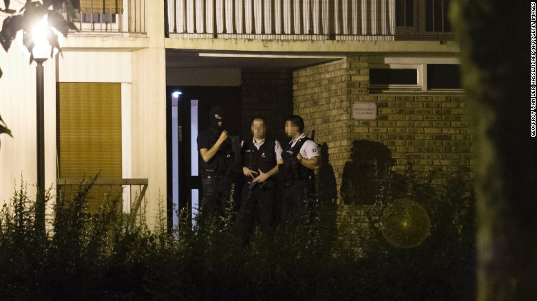 Police appear outside a building Thursday in Boussy-Saint-Antoine  after the arrest of female suspects.