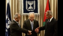 Israeli President Shimon Peres, center, joins hands with Jordan's Foreign Minister Abdul-Ilah Khatib, left, and Egyptian Foreign Minister Ahmed Aboul Gheit during their meeting in Jerusalem on July 25, 2007.The foreign ministers of Egypt and Jordan made a historic visit to Israel to formally present an Arab peace plan, saying they were extending "a hand of peace." 