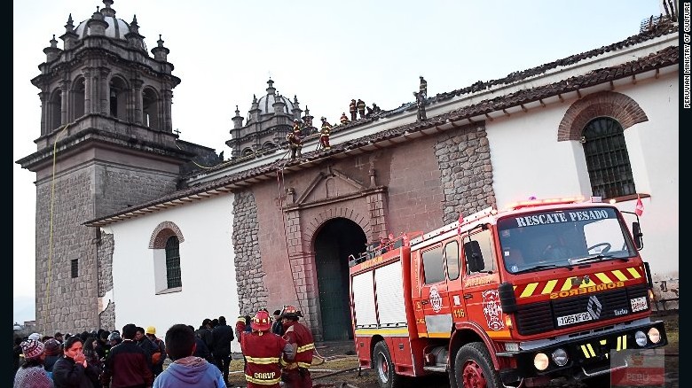 Officials assess the damage to the San Sebastian Church in Cusco, Peru, after a devastating fire Friday, September 16. 