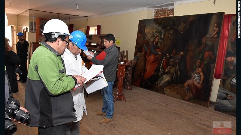 Peruvian Ministry of Culture officials inspect damage to artwork at San Sebastian Church. The fire consumed priceless works from the so-called Cuzco School of Roman Catholic art.