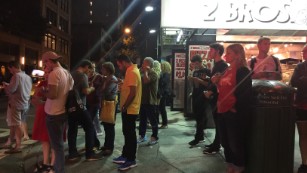 People gathered outside near an explosion in the Chelsea neighborhood in NYC