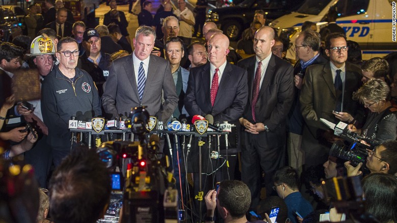 Mayor Bill de Blasio, center, and NYPD Chief of Department James O'Neill, center right, speak during a press conference near the scene.