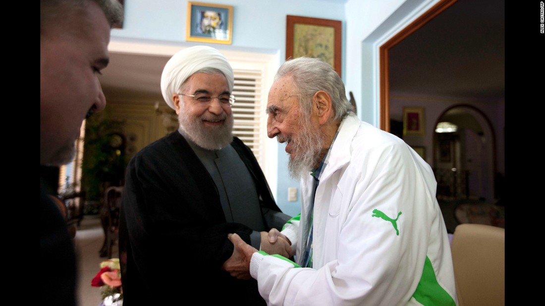 Iranian President Hassan Rouhani, center, shakes hands with former Cuban leader Fidel Castro during a visit to Havana, Cuba, on Monday, September 19.