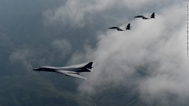 A U.S. Air Force B-1B Lancer is flanked by two F-15K Slam Eagles during a flight over South Korea, September 21, 2016.