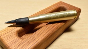 The pen used to sign the treaty is made from a bullet used in combat.