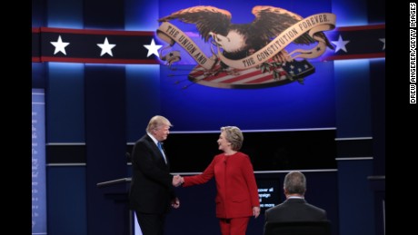 (L-R) Republican presidential nominee Donald Trump and Democratic presidential nominee Hillary Clinton shake hands prior to the start of the Presidential Debate at Hofstra University on September 26, 2016 in Hempstead, New York.  The first of four debates for the 2016 Election, three Presidential and one Vice Presidential, is moderated by NBC's Lester Holt.