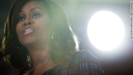 Fiery Michelle Obama goes after Trump in Charlotte, taps microphone