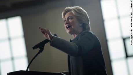 On service, Clinton separates Trump from past GOP presidents